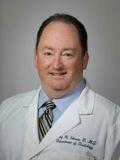 Dr. Garry Simons, MD