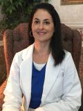 Dr. Ela Torres-Moore, DMD