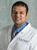 Dr. Maan Dhanjal, DC