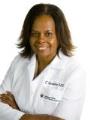 Dr. Carline Quander, MD