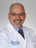 Dr. Comisi